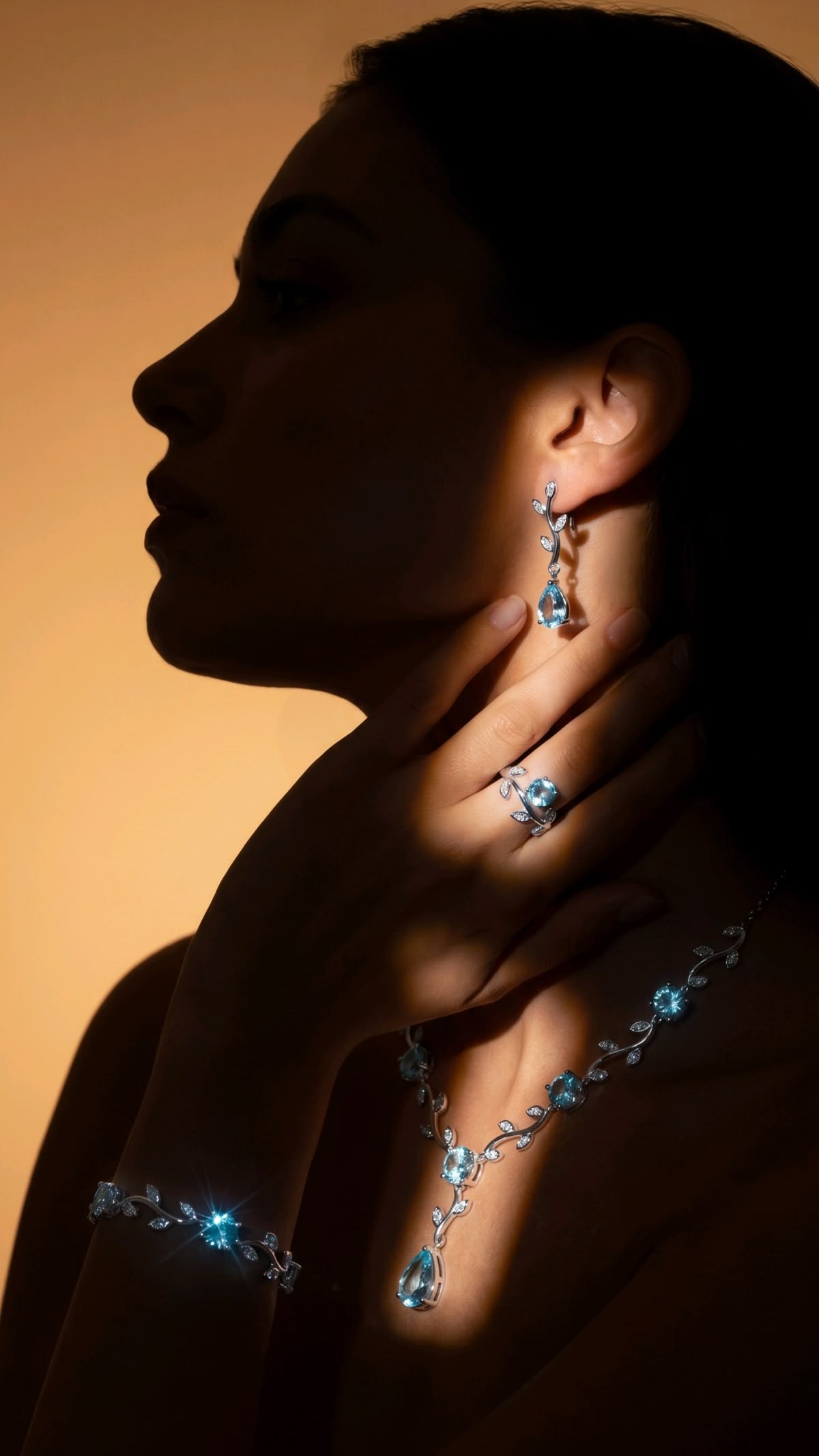 Model wearing Caratleaf blue-stone earrings, necklace and bracelet